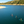 Load image into Gallery viewer, Photo of three people in each of the Jobe's paddle boards, yarra, duna and Mira on the sea with the mountains on the background