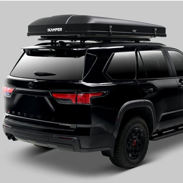 iKamper Skycamp 4.0 Quad closed on roof bars, rear three-quarter view