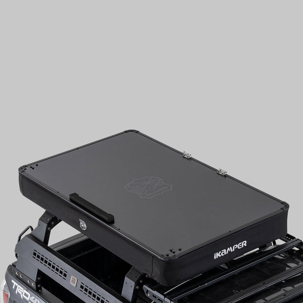 iKamper X-Cover 3.0 closed hard top on a bed rack, elevated view
