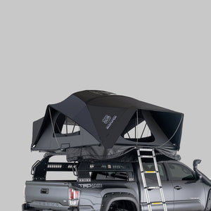 iKamper X-Cover 3.0 hybrid rooftop tent open on a ute bed rack with ladder